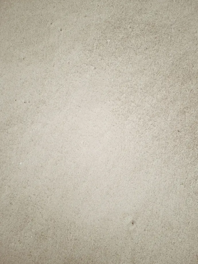person in black shoes standing on gray concrete floor